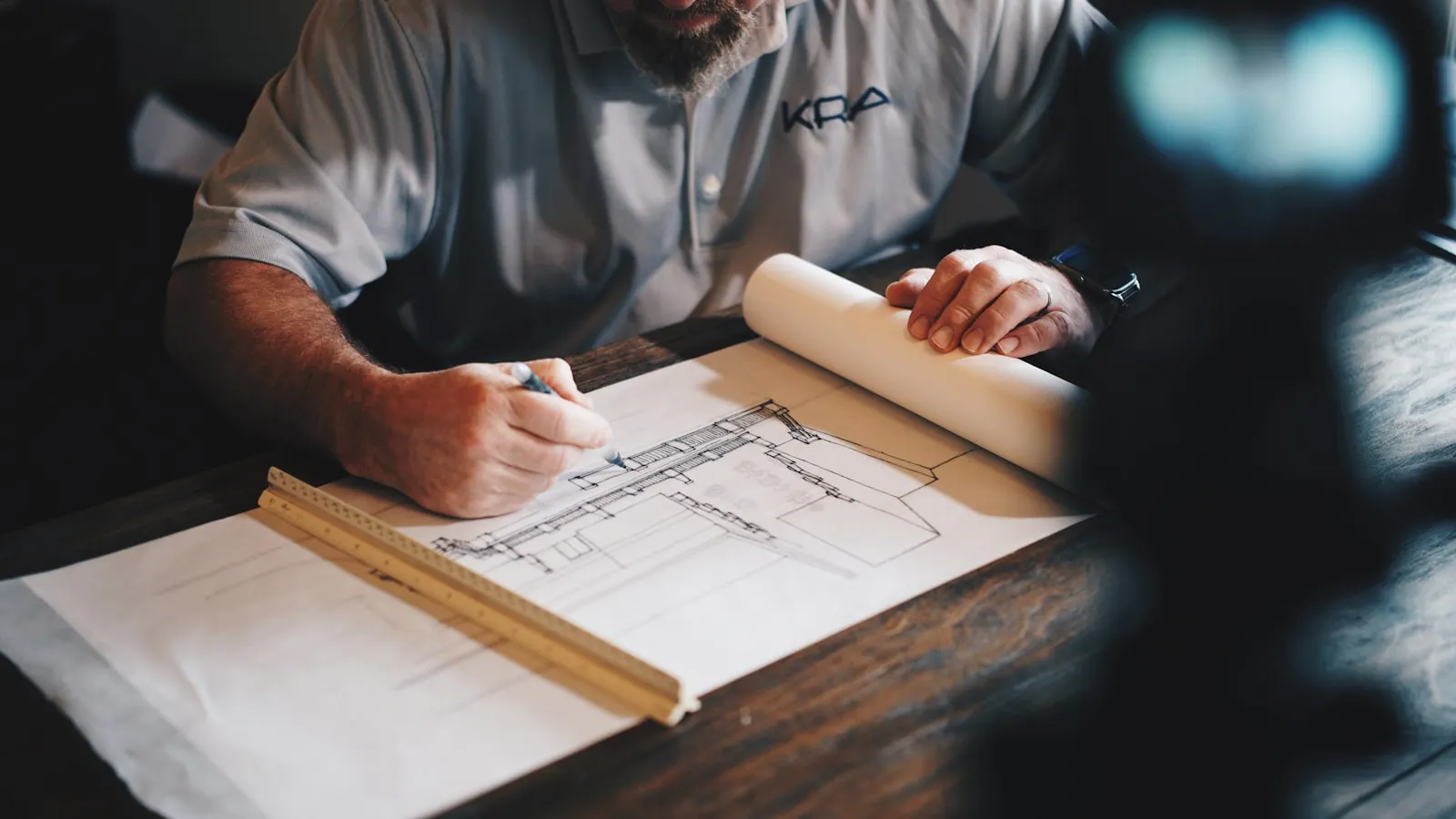 Architectural drafting tools, representing a site built to specification rather than assembled